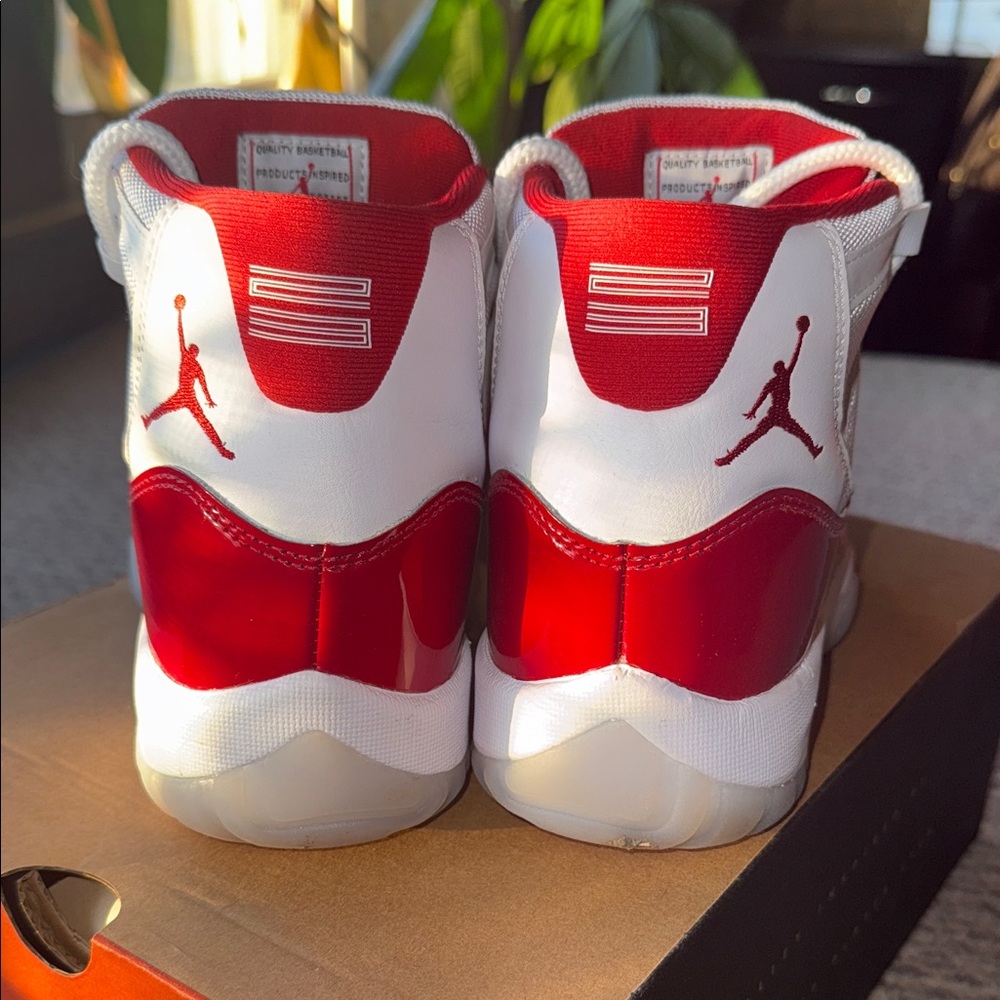 Jordan Cherry Red 11s High-Top Red and White Sneakers - Picture 5 of 9